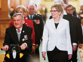 Lt.-Gov. David Onley and New Premier Kathleen Wynne leave the Legislature at Queen’s Park in Toronto on Tuesday. 
QMI Agency