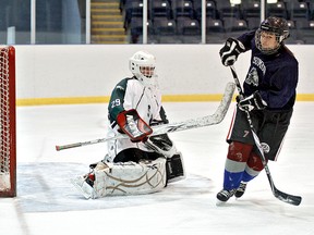 KARA WILSON, for The Expositor      

Assumption's Zoe Talbot scores on St. John's goaltender Sara Fisher-Robertson during a penalty shot in high school girls hockey game Tuesday at Wayne Gretzky Sports Centre.