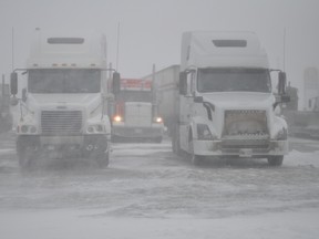 Clarise Klassen/Portage Daily Graphic
Blizzard-like conditions reduced visibility and closed highways on Louis Riel Day, causing many to find a place to wait out the storm, such as the Portage la Prairie Mall parking lot Monday morning.