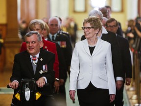 Lt.-Gov. David Onley and New Premier Kathleen Wynne leave the Legislature at Queen's Park in Toronto on Tuesday Feb. 19, 2013. Ernest Doroszuk/Toronto Sun/QMI Agency