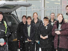 As the snow started to fall staff of Winkle’s Your Independant Grocers gathered outside the store in Espanola with Angele Vanier and her son Tyler Leduc who received financial assistance to purchase the much needed wheelchair van. The van has already been a blessing to the young family as they make daily trips to Tyler’s therapy appointments. 
In the photo are: Tom Gerrie, Angele Vanier, Tyler Leduc, Justin Caldwell, Melissa Ankersmit,Trish Larose, Kim Gardiner, Kateline Fraser, Kristi Bouillon, Margaret Munsterhelm, Tyler Larabie and Dylan Miles.  

Photo by Dawn Lalonde/Mid-North Monitor/QMI Agency