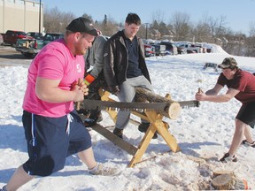 Thomas Booker, left, and Jimmy Youngbut, right, both from the Niagara Region, work on crosscutting with a saw during the woodsman’s competition held as part of the Junior Farmer Provincial Winter Games, held in Pembroke and Cobden this past weekend. Thomas Judd of Simcoe helps to steady the log. Representatives of 20 junior farmers groups attended the games, held at Bishop Smith Catholic High School and in Cobden. For more community photos, please visit our website photo gallery at www.thedailyobserver.ca.