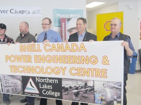 Logan Clow/R-G
On Wednesday February 13, 2012 at Northern Lakes College in Peace River. Shell Canada announced a $500,000 donation through their Social Investment Program that will go toward the collegeís Peace River Regional Power Engineering Project which will be known as the Shell Canada Power Engineering and Technology Centre. Pictured (l-r): Terry Friesen (Power Engineering Student), Patrick Evans (Power Engineering Student), Rick Neidig (College President and CEO), Robert Blachford (Shell Operations Manager Peace River Area) and Geoff Milligan (Councillor with the Town of Peace River) unveil the name.