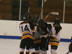 Players from the Jr. Kings Atoms team celebrate goal #6 in their game against Grande Prairie Sunday. The team finished ahead 7-4.