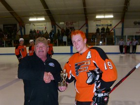 North West Junior Hockey League president Al Spence (left) presented the trophy for Most Valuable Player to Brennan Romanovitch of the Fairview Flyers Jr. B team