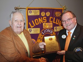 Lions Club A-5 district governor Andrew McRae presents Larry Shanahan with a commemorative plaque honouring his 55 years of membership.
Photo by JORDAN ALLARD/THE STANDARD/QMI AGENCY
