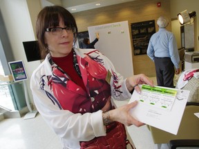 A nurse show shows off a fecal occult blood test used to test for colorectal cancer. Postmedia Network