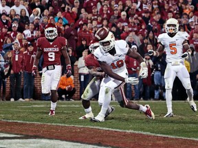 A man from Perkins, Okla., has been accused of abusing his son because he roots for a rival football team. (BRETT DEERING/Getty Images/AFP)