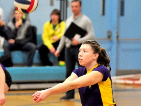 Sarah Smith, of the École secondaire Alliance Ours, gets under the ball as she digs out a return during the second set the Ours match against the Timmins High & Vocational School Blues on Wednesday. The Ours defeated the Blues 25-19, 18-25 and 16-14.