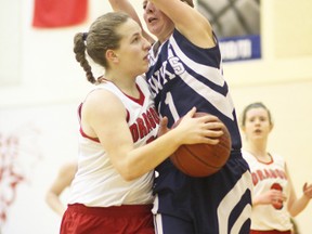 KEVIN RUSHWORTH PHOTO. The senior girls St. Michael's Dragons basketball team challenged the Matthew Halton Hawks on the court Feb. 13. The Dragons walked away with a win after a game that ended 70-36.