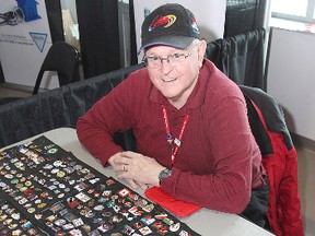 Pin collector Dave Phillips sets up his display for Tuesday afternoon's draw in the Scotties Tournament of Hearts at the K-Rock Centre.
Michael Lea The Whig-Standard