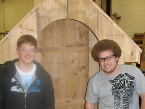 Zach Schanden and Brad Hume, Grade 11 students at Delhi District Secondary School, stand with a small garden shed that will be auctioned off at the Haldimand-Norfolk Home Builder's Association Home Show at the Aud in Simcoe Feb. 22 to Feb. 24. Proceeds will go to the Spot Youth Centre in Simcoe. (SARAH DOKTOR Delhi News-Record)