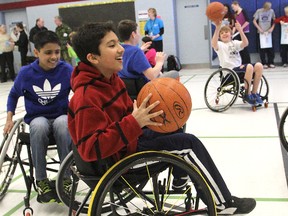 Students from Lancaster Drive Public School try their hand at wheelchair basketball during an event Wednesday morning to promote the upcoming 2013 Ontario ParaSport Games.
Michael Lea The Whig-Standard