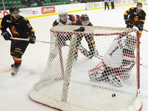 The puck enters the Ottawa 67's net during OHL action at Yardmen Arena Wednesday night. The Belleville Bulls won 8-5 to extend their current win streak to seven. (Jason Miller/The Intelligencer.)