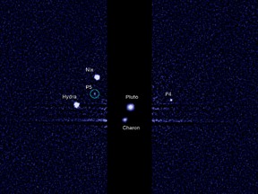 This image, taken by the NASA/ESA Hubble Space Telescope, shows five moons orbiting the distant, icy dwarf planet Pluto. The green circle marks the newly discovered moon, designated S/2012 (134340) 1, or P5, as photographed by Hubble’s Wide Field Camera 3 on 7 July 2012.