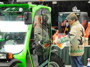 Michael Alexander, sales representative for Merol, prepares Panoramic P25.6 tractor during last year’s Peace Country Classic Agri-Show at the Evergreen Park TEC Centre. Agri-Show president Dave Martin says this year’s show will be better than ever. (PC Sun file photo)