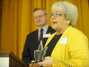 Pam Tournigny, of Friends of the Warwick Conservation Area, accepts an award in Sarnia, Ont. Thursday, Feb. 21, 2013. The St. Clair Region Conservation Authority handed out several conservation awards at its annual general meeting. Other recipients included freelance journalist Heather Wright, the Sarnia Environmental Advisory Committee, and the McKenzie and Blundy Funeral Home. (BARBARA SIMPSON, The Observer)