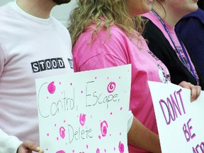 Staff and administrators at Ecole McTavish sported pink shirts and signs during their anti-bullying day rendition of “True Colours.” AMANDA RICHARDSON/TODAY STAFF