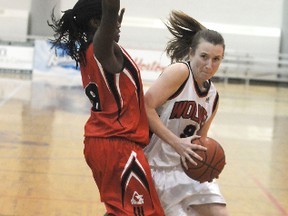 Wolves guard Kelly O’Hallahan drives to the basket past Augustana Vikings guard Monique Jarrett in an ACAC match earlier this month. O’Hallahan is the second-highest scoring female college basketball player in the country. She and her Wolves teammates will be going up against Canada’s top-scoring player – Jylisa Williams– in Olds tonight. The winner of the game advances to the ACAC provincial tournament. (TERRY FARRELL/DAILY HERALD-TRIBUNE)