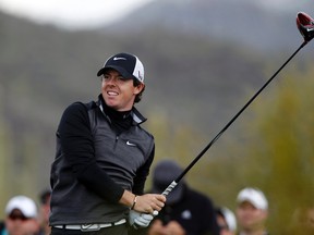 Rory McIlroy watches his drive off the second tee during his match with Shane Lowry in the weather-delayed first round of the WGC-Accenture Match Play Championship February 21, 2013. (REUTERS/Matt Sullivan)