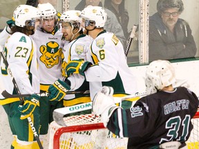 The University of Alberta Bears, shown here celebrating a goal against the Saskatchewan Huskies in January, are ranked No. 2 heading into the playoffs. (Amber Bracken, Edmonton Sun)