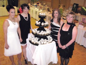 Dressed to the nines and ready to greet guests arriving for the 2012 Black and White Ball, Hope and the City co-chairs (left to right) Ashley Hoffmeister, Shannon Bailey and Panayiota Straight take a moment to pose for a photo with Canadian Cancer Society Northwestern Ontario fundraising coordinator Margaret Saville. The second annual girls night out event in Kenora, April 28, 2012 drew a well-heeled crowd of over 200 and raised $22,500 for the society through ticket sales, donations and silent auction.
FILE PHOTO/KENORA DAILY MINER AND NEWS