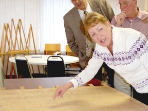 Heritage Kincardine unveiled a historic map of the area during a Feb. 21 meeting of Kincardine. The map, which was hand-drawn by J. H. Scougall in 1880, took four years to restore. Mayor Larry Kraemer and councillors Randy Roppell and Maureen Couture inspected refurbished document.