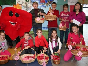 The student council at École catholique Anicet-Morin raised $600 for the Heart and Stroke Foundation in Timmins through Valentine’s Day-themed event. The council members in the front row from left are Sara Labine, Pierre Racicot, Maxim Caron, Alexa Caron and Michelle Girard. In the back row, from left, are Damon Demontigny, Tyler Neeley (dressed as Heartly), Corey Lepage, Owen Meunier, Ryan Loranger, who is the prime minister of the student council, and Pierrette Levesque, the teacher in charge of student council.