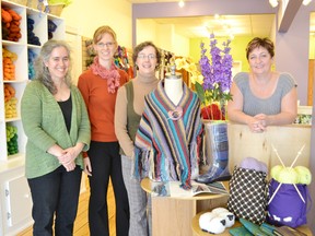 Celebrating their grand opening from left to right are Jeffi Farquharson, Kirsten Dyer, Peggy Call and owner Sue Gundrum.