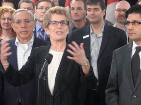 Ontario Premier Kathleen Wynne answers questions from reporters after a jobs roundtable at Ross Video in Ottawa Friday, Feb. 22, 2013. 
JON WILLING/OTTAWA SUN/QMI AGENCY