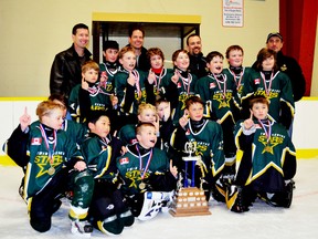 Twin Centre Stars make a statement at the South-Port Optimist hockey tournament in Southampton on Feb. 16, beating Shallow Lake 9-2. Pictured above is the winning team, Twin Centre Stars celebrating their victory coming in first place.