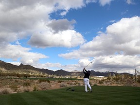 Shane Lowry of Ireland hits his tee shot on the sixth hole during the first round of the World Golf Championships - Accenture Match Play at the Golf Club at Dove Mountain Round one play was suspended due to inclimate weather. (Jed Jacobsohn/Getty Images)