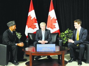Prime Minister Stephen Harper, centre, meets with Lal Khan Malik, left, national president of Ahmadiyya Muslim Jama?at Canada, and Andrew Bennet, ambassador of the federal government?s new Office of Religious Freedom. Columnist Larry Cornies says the usefulness of such an office should not be dismissed. (Jon Blacker, Reuters)