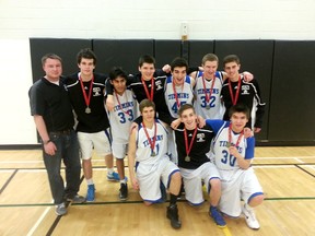 The Timmins High & Vocational Blues senior basketball team poses with the Northeastern Ontario Athletic Association 'AA' championship basketball medals following a 59-31 win over the TDSS Saints on Thursday.