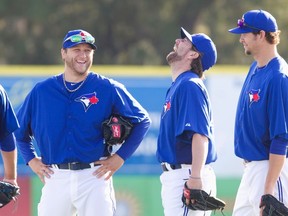 Toronto Blue Jays pitcher Mark Buehrle (L) with teammates R.A. Dickey (C) and Josh Johnson at the team's MLB baseball spring training facility in Dunedin, Florida February 22, 2013. (Fred Thornhill/Reuters)