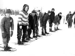 Young participants in the 1962 Timmins Winter Carnival prepare to compete in snowshoe races at Kenogamissi Lake. Other events included snowmobile races, snow sculpture contests and the infamous polar bear dip.