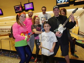 Employees from Vuteq were one of nine teams from the company that competed in Big Brothers/Big Sisters of Woodstock fundraiser at C&D Lanes on Friday evening. Back row from left:  Korey Halford, Bradley Gordon and Kristen Moesker. Front row left Ellen Hargreaves, Angeline Vanderhaegh holding Lukas Halford, Jaylen Jackson and Jeremy Jackson. HEATHER RIVERS/WOODSTOCK SENTINEL-REVIEW