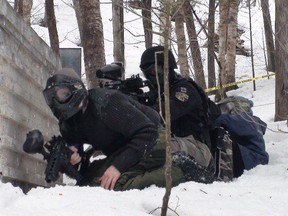 Photo courtesy of Michael Vaillancourt 
Members of the Northern Ontario SAS Woodsball paintball team compete in the snow.