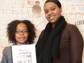 Raeon George-Robinson and his mother Rhonda George at Grey Roots Saturday to launch Vol. 10 of "Northern Terminus: The African Canadian History Journal". The two wrote an essay together for Volume 10 about a school field trip to Priceville to learn more about the area's black history. Raeon, 10, became inspired to learn more about black history because of U.S. President Barack Obama.