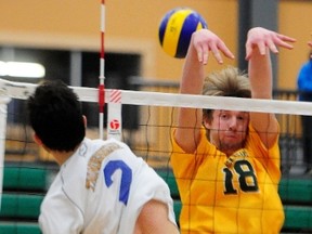 University of Alberta Golden Bears' Brett Walsh goes up to block a shot during their Canada West Men’s Final Four bronze medal volleyball game against the University of British Columbia Thunderbirds at the Saville Community Sports Centre on Saturday, Feb. 23, 2013. The Golden Bears won the game in three sets,- 25-14, 25-14, 25-20. TREVOR ROBB/EDMONTON EXAMINER