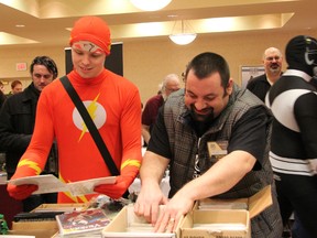 Wade Alexander (aka "Flsah") and Mike Morgado sift through some comic books at the Sarnia Pop Culture Show held at the Holiday Inn, Sunday. The multi-genre convention, which featured comic books, games, and several fan related vendors, drew hundreds of visitors. TARA JEFFREY/THE OBSERVER/QMI AGENCY
