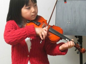 Rosa Chang, 6, plays her violin in preparation for the Norfolk Musical Arts Festival. The festival kicks off Monday, Feb. 25, 2013 in Simcoe. (Contributed photo)