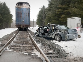 A vehicle travelling south on Oxford Road 4 struck a CP Rail train travelling east about 10:21 a.m. in Woodstock. The elderly driver of the car was extracted from the wreckage and airlifted to Victoria Hospital in London with non-life threatening injuries. CRAIG GLOVER/THE LONDON FREE PRESS/QMI AGENCY