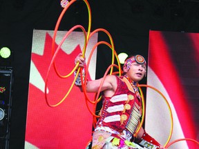 Dallas Arcand, a world champion hoop dancer from the Alexander Kipohtakaw Cree First Nation near Edmonton, performs at MacDonald Island Park for the Canada Day barbecue in 2012.