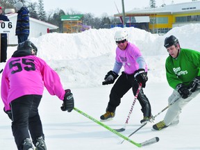 Action from the A-Side final between the Rum Runners and Wolf Pak at the Western Canadian Pond Hockey Championships at Island Park in Portage la Prairie on Sunday. (Kevin Hirschfield/Portage Daily Graphic/QMI AGENCY)