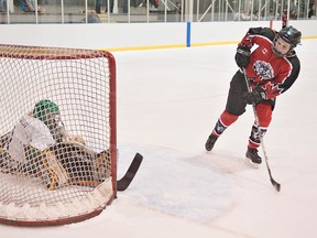 BRIAN THOMPSON, The Expositor

Mary Hanna of the Brantford Ice Cats watches her shot beat Almaguin Gazelles goalie Fiona Weaver in an overtime shoot-out on Sunday in the midget B final at the Walter Gretzky Girls Hockey Tournament at the Wayne Gretzky Sports Centre.  The goal was disallowed when the referee ruled Hanna came to a stop. A Gazelles player subsequently scored in the next round of the shootout to win 1-0.