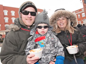 BRIAN THOMPSON, The Expositor

Matt and Melissa Freeman of Brantford and their three-year-old son, Mylz, bundle up Sunday for the Chili Willy Cook-Off at downtown Harmony Square.  Turn to Page A2 for a story and photos.