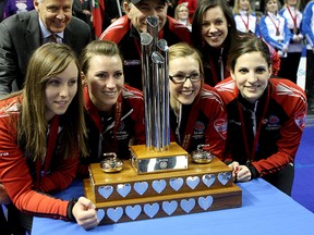 Team Ontario, from left, Rachel Homan, Emma Miskew, Alison Kreviazuk  and Lisa Weagle, celebrate winning the Scotties Tournament of Hearts with a 9-6 win over Manitoba in Kingston at the K-Rock Centre on Sunday.
IAN MACALPINE/Kingston Whig-Standard/QMI Agency