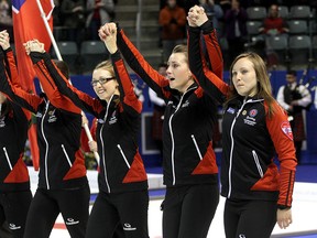 Team Ontario,  from left, Lisa Weagle, Alison Kreviazuk, Emma Miskew and Rachel Homan celebrate winning the  Scotties Tournament of Hearts with a 9-6 win over Manitoba in Kingston at the K-Rock Centre on Sunday February 24 2013. IAN MACALPINE/Kingston Whig-Standard/QMI Agency