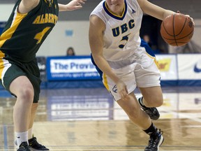 Alberta's Sally Hillier guards a UBC player during 2013 Canada West women's basketball quarterfinal action in Vancouver.